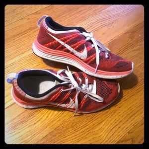 Red Nike tennis shoes